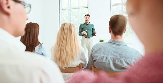 The people at Business Meeting in the empty conference hall. Business and Entrepreneurship concept.