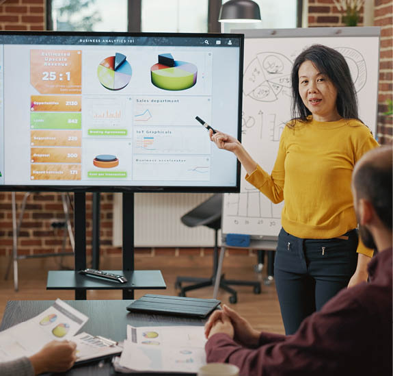 Coworkers attending briefing meeting together in boardroom, discussing business growth and development. Group of people brainstorming ideas to plan creative presentation on display.