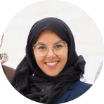 Successful interracial business team with tablet posing outside. Businessman and Muslim businesswomen standing outdoors, holding tablet and looking at camera. Diverse colleagues conce